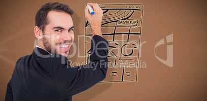 Composite image of happy businessman writing with marker