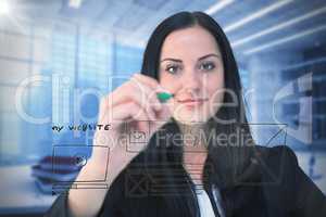 Composite image of pretty businesswoman writing with marker