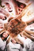 Group of environmentalists stacking hands