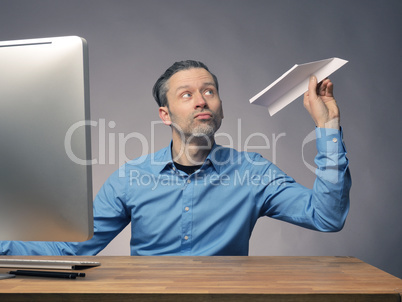Businessman with a paper plane