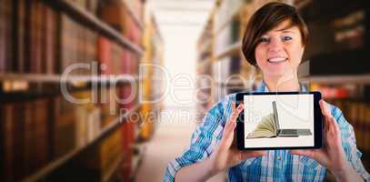 Composite image of smiling woman showing digital tablet with blank screen