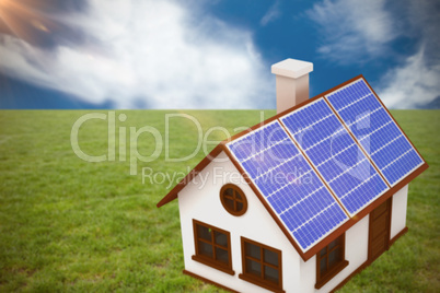 Composite image of 3d image of house with solar panels