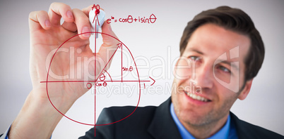 Composite image of businessman writing with red marker