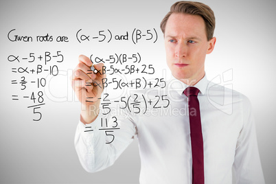 Composite image of businessman writing something with chalk