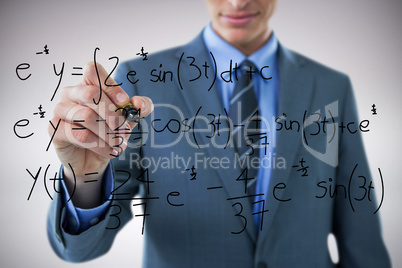 Composite image of midsection of well dressed businessman holding marker
