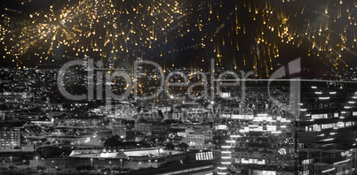 Composite image of colourful fireworks exploding on black background