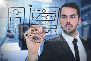 Composite image of focused businessman writing with marker