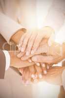 Close up of business team stacking hands