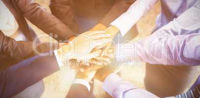 High angle view of businesspeople stacking hands