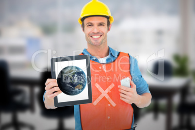 Composite image of carpenter holding digital tablet and mobile phone