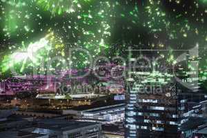 Composite image of colourful fireworks exploding on black background