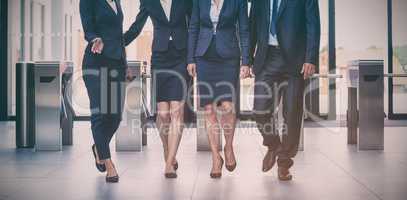 Businesspeople walking in office
