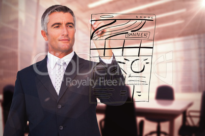 Composite image of handsome businessman writing with marker