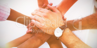 Overhead view of colleagues stacking hands