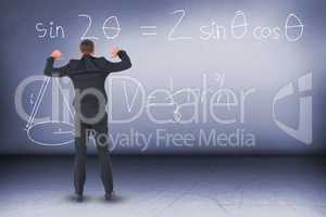 Composite image of businessman standing with hands up