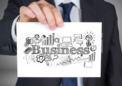 Businessman holding card with business graphics drawings