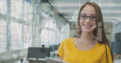 Woman in yellow in office behind gear and chart graphic overlay