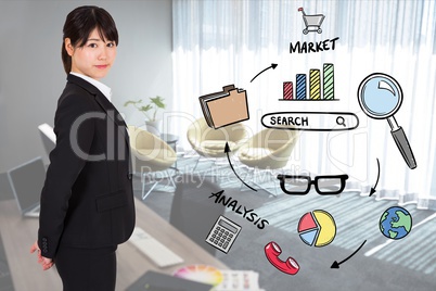 Portrait of businesswoman standing by various icons in office
