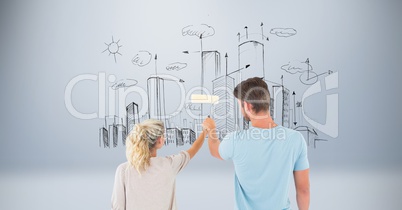 Digital composite image of couple holding paint roller with buildings in background