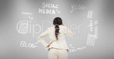 Rear view of businesswoman with text and social media ideas