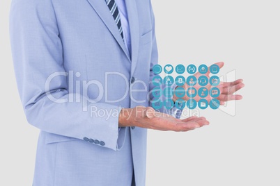 Midsection of businessman with medical symbols