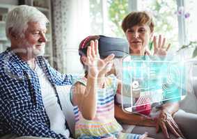 Child wearing VR Virtual Reality Headset with Interface with Grandparents