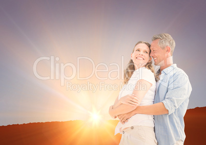 Couple in front of the sunset