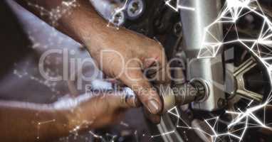 Close up of hands working on wheel with white network