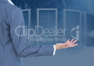 Businessman with hand open against servers