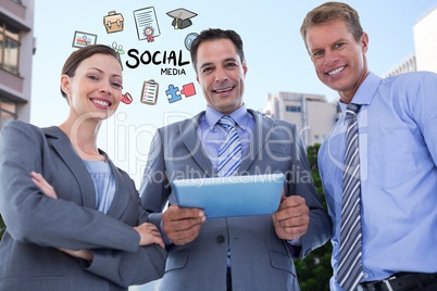 Happy business people with digital tablet and social media icons