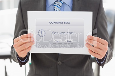 Digital composite image of businessman holding confirm box