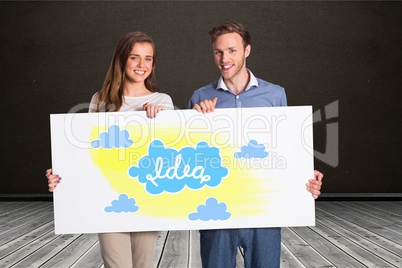 Happy couple holding billboard with idea and cloud signs