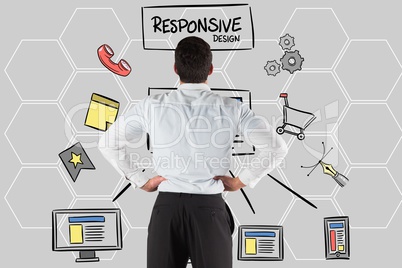 Rear view of businessman looking at responsive design text and icons