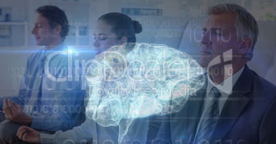 Multiple exposure of business people meditating with brain in foreground