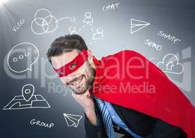Business man superhero with head on hand against navy background with white business doodles and fla