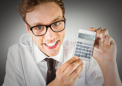 Nerd with calculator against grey background