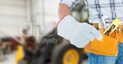 builder with his tools with blurred background