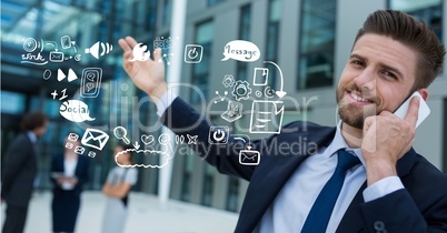 Businessman using mobile phone by icons representing multi tasking