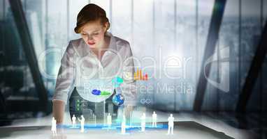 Businesswoman standing at futuristic desk