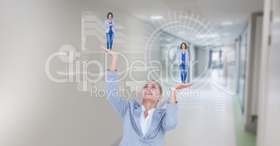 Digital composite image of businesswoman holding executives in hands with symbols