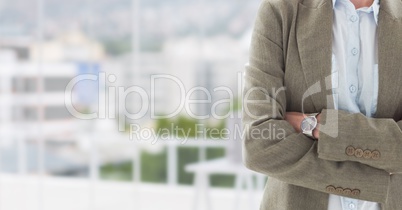 Hands folded with watch on blurred background