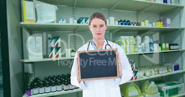 Doctor showing blank slate in pharmacy