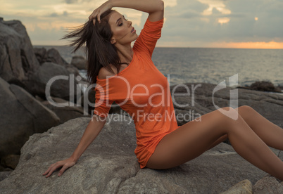 Pretty woman on the rocks