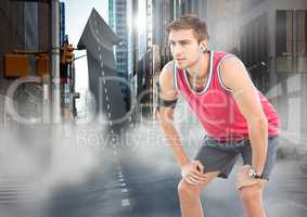 Male runner with headphones on arrow shaped road in street