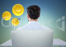Back of man sitting with emojis against blue green background