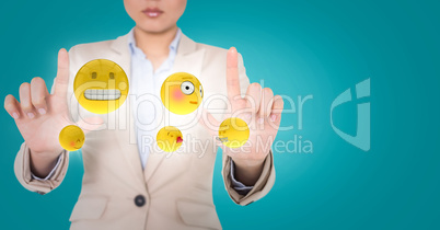 Business woman with emojis and flares between hands against blue background