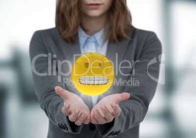 Business woman with hands out and emojis with flares against blurry window