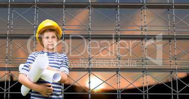 Boy with blueprints in front of 3D scaffolding