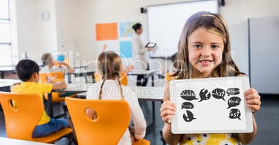 Cute girl showing symbols on tablet computer in classroom