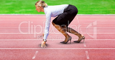 Digitally generated image of Businesswoman on starting point at racing track